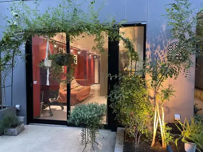 a window of a store with plants in it at Tokyo Asakusa's Local Side in Wada