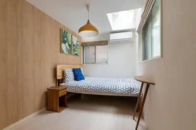 a small room with a bench and a window at Urbané Villa -Kaname House- in Tokyo