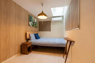 a small room with a bench in a room at Urbané Villa -Kaname House- in Tokyo