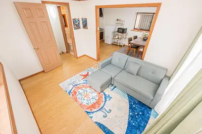 a living room with a couch and a table at self-check in CASA shinjuku in Tokyo