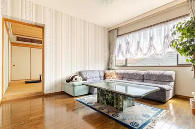 a living room with a couch and a table at Kizen Villa in Tokyo