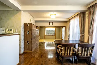 a kitchen and dining room with a table and chairs at Kizen Villa in Tokyo