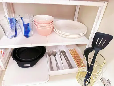 a shelf with dishes and utensils in a kitchen at 401Room, 5 mins walk from JR Kinshicho North Exit!Near Asakusa & Sky Tree!! The house is on the 4th floor with an elevator convenient transportation There is a balcony in Tokyo