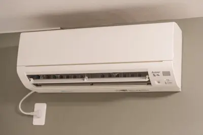 a air conditioner is attached to a wall at Takasa House in Tokyo