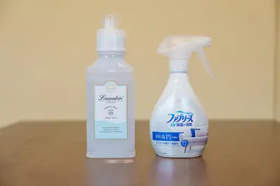 a bottle of detergent and a bottle of cleaner on a table at Takasa House in Tokyo