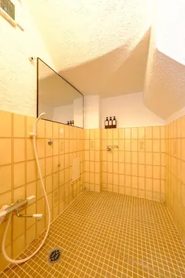 a bathroom with a shower with a mirror at M-Base Ryogoku Tokyo - Easy Access to Asakusa & Skytree - Steps to Sumo Stadium & Museum in Tokyo