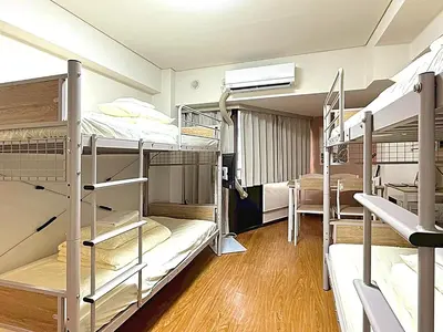 a dorm room with several bunk beds in it at Shibuya Lions in Tokyo