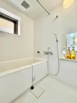a white bathroom with a shower and a tub at Tokyo Stay Itabashi #102 in Tokyo