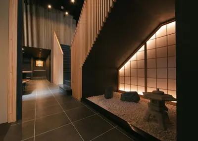 a hallway with a table in the middle of a building at A-LifePENTHOUSE in Tokyo
