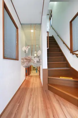 a staircase in a house with wooden floors at Tokyo Tsuruga Villa\u30fc\u6771\u4eac\u96c5\u9db4 in Tokyo