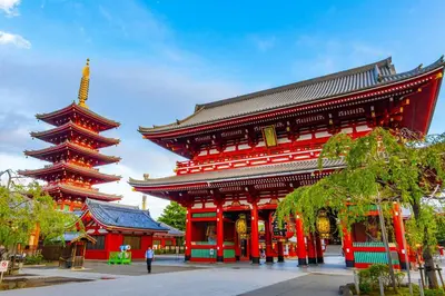 a large red building with a pagoda at \u6625\u660eHouse in Tokyo