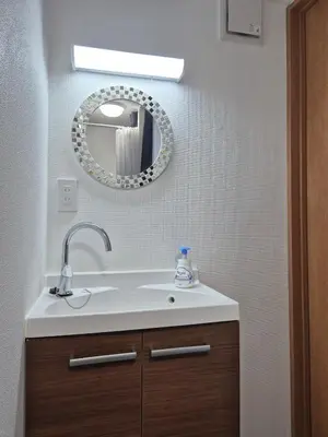 a bathroom with a sink and a mirror at Ardel-hohu luxuryroom-1st floor-3 Bedroom-3shower,110square in Tokyo