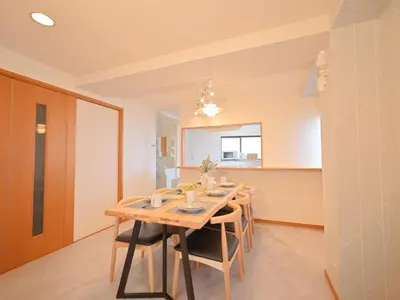 a dining room with a wooden table and chairs at Kiryo Tokyo Kami Itabashi 2 Bedroom Apartment with Kitchen near Ikebukuro in Tokyo