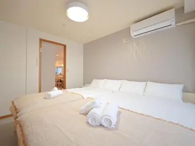 a bedroom with two beds with towels on them at Kiryo Tokyo Kami Itabashi 2 Bedroom Apartment with Kitchen near Ikebukuro in Tokyo