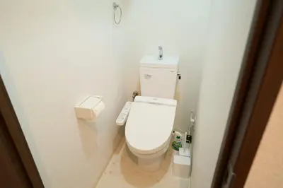 a bathroom with a white toilet with a remote control at Triphome Kototoibashi Facing Tokyo Skytree in Tokyo