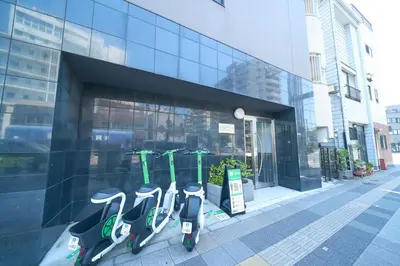 a group of scooters parked in front of a building at Triphome Kototoibashi Facing Tokyo Skytree in Tokyo