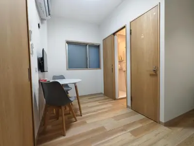 a room with a table and a chair and a door at Makino Building - Vacation STAY 14797v in Tokyo