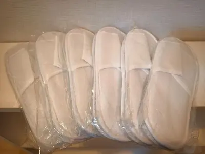 a group of white shoes in a plastic bag at Makino Building - Vacation STAY 15981v in Tokyo