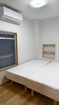 a bedroom with a large white bed and a window at Makino Building - Vacation STAY 15981v in Tokyo