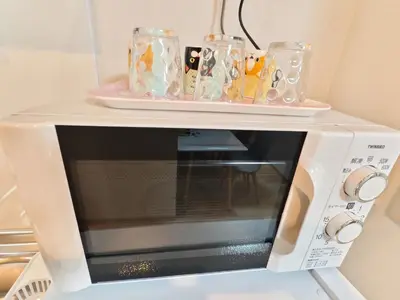 a microwave with two dishes on top of it at Makino Building - Vacation STAY 15769v in Tokyo