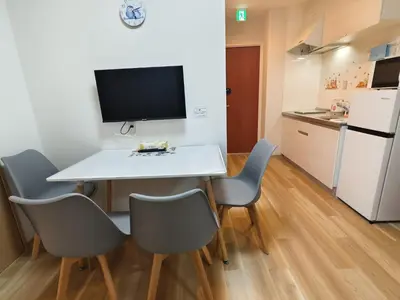 a small kitchen with a table and chairs in a room at Makino Building - Vacation STAY 15769v in Tokyo