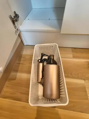 a metal tea kettle in a basket on a wooden floor at Makino Building - Vacation STAY 15769v in Tokyo