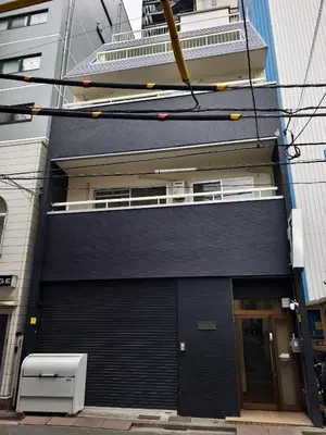 a black building with a large garage door at Makino Building - Vacation STAY 15661v in Tokyo