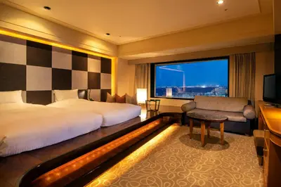 a hotel room with a bed and a television at Urayasu Brighton Hotel Tokyo Bay in Urayasu