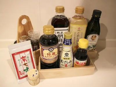 a wooden container filled with different types of sauce at IKEPOND HOUSE Tokyo in Tokyo