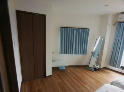 a room with a closet and a mirror in a room at \u611b\u306e\u5c4b\u6c11\u6cca\u6c60\u888b in Tokyo