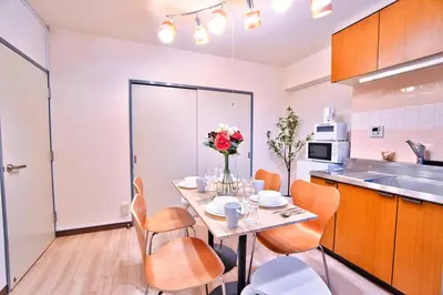 a kitchen and dining room with a table and chairs at LCE203 6min Shimo Sta 13min Akabane Max 8 in Tokyo