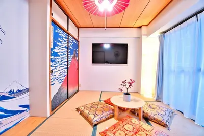 a living room with a table and a tv at LCE203 6min Shimo Sta 13min Akabane Max 8 in Tokyo