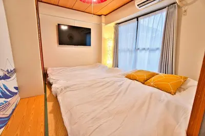 a bedroom with a large bed with a large window at LCE203 6min Shimo Sta 13min Akabane Max 8 in Tokyo