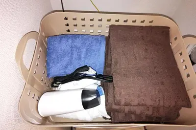 a laundry basket filled with towels and a towel at 1 stop from Shinjuku, 3 minutes, Japanese-style room, with balcony, Japanese modern in Tokyo
