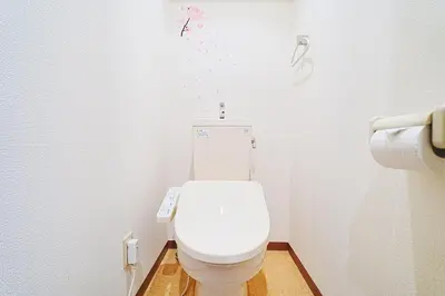 a bathroom with a white toilet with confetti on the wall at 1 stop from Shinjuku, 3 minutes, Japanese-style room, with balcony, Japanese modern in Tokyo