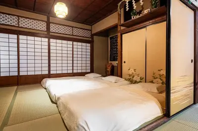 a bedroom with two beds in a room at comin in Tokyo