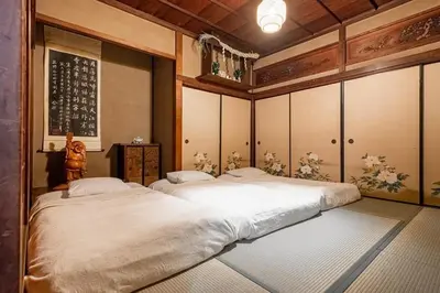 two twin beds in a room at comin in Tokyo