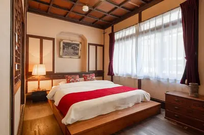 a bedroom with a large bed and a window at comin in Tokyo