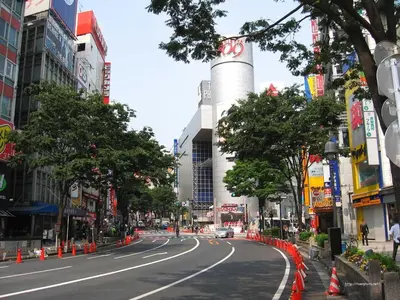 an empty street in a city with a building at 6min Shibuya Station 4 Max A165 in Tokyo