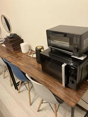 a microwave and a toaster oven on a wooden table at 6min Shibuya Station 4 Max A165 in Tokyo