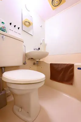 a bathroom with a white toilet and a sink at 6min Shibuya Station 4 Max A165 in Tokyo