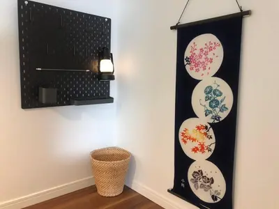 a black and white wall with plates on it at 203 Yamanote Line Near Ueno Park Cozy New Apartment in Tokyo
