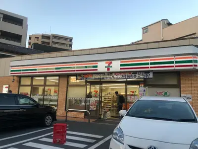 a white car parked in front of a store at 203 Yamanote Line Near Ueno Park Cozy New Apartment in Tokyo