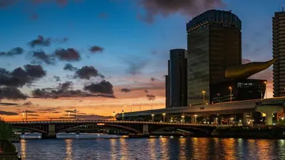 a bridge over a river in a city at sunset at Sunny Home Asakusa in Tokyo