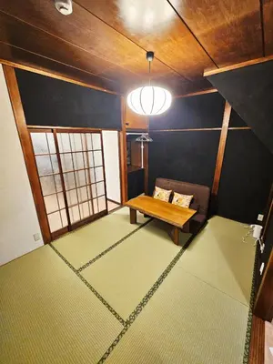 a room with a couch and a table in it at Japanese-Tradtional House Max 8 Guest 6-Min Walk from Station Check-out at 12 PM in Tokyo