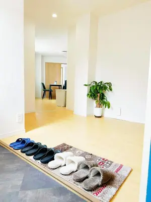 a pile of towels on a rug in a room at \u6587\u4eac\u30cf\u30a6\u30b9301 in Tokyo