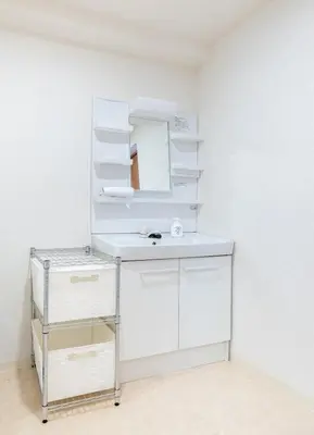 a white bathroom with a sink and a mirror at -Park Higashiueno- 4-minute walk from Ueno Station in Tokyo