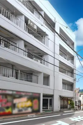 an apartment building on the side of a street at Sakura in Tokyo