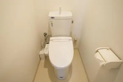 a small bathroom with a toilet and a sink at 67LEREVE Ikebukuro in Tokyo