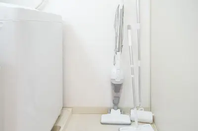 a hospital room with a iv machine in the corner at 67LEREVE Ikebukuro in Tokyo